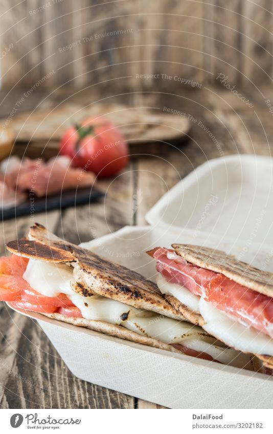 Piadina typical italian food Meat Cheese Vegetable Bread Nutrition Breakfast Lunch Dinner Vegetarian diet Diet Italian Food Wood Fresh Delicious Tradition