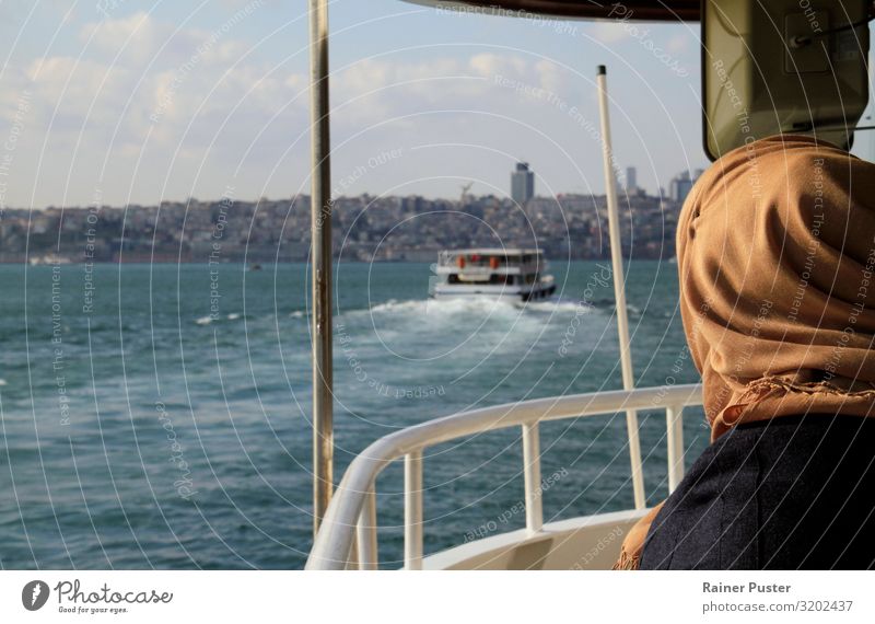 On the ferry in Istanbul Woman Adults River The Bosphorus Turkey Ferry Headscarf Blue Brown Wanderlust Exterior shot Copy Space left Copy Space top