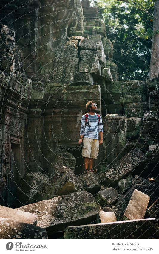 Traveler on rocks of ancient temple Man Temple Ruin Ancient explore Thailand Historic Architecture Monument Vacation & Travel Inspiration Landscape