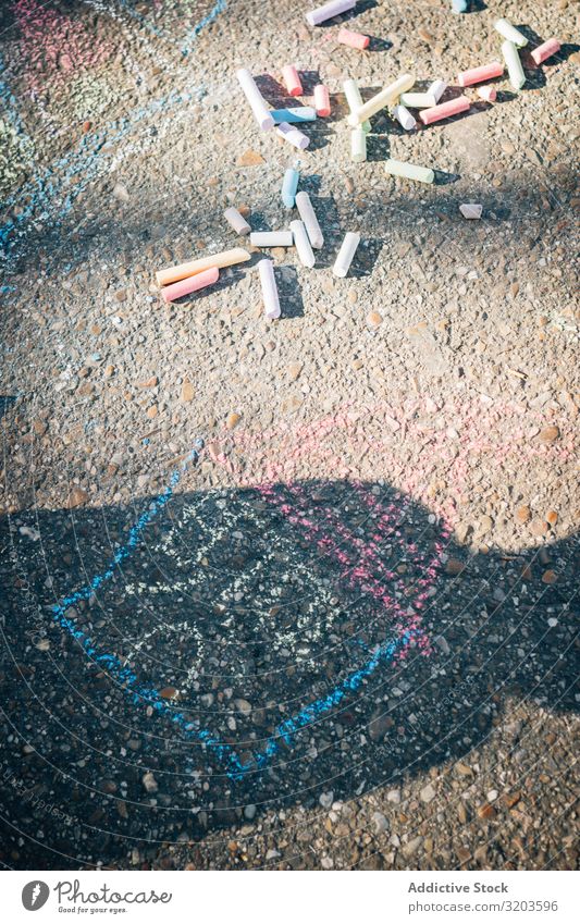 Colored chalk on pavement in sunny day Chalk Art Painting and drawing (object) Asphalt Creativity Street Playground Multicoloured Infancy Playing artistic
