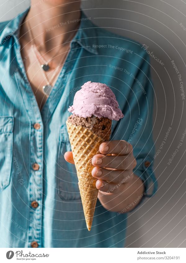 Ice cream scoop in cone in woman hands Scoop Food Cream Cone Sundae Difference Blue Hand Background picture Summer Ball biscuits Blueberry Chocolate Cold