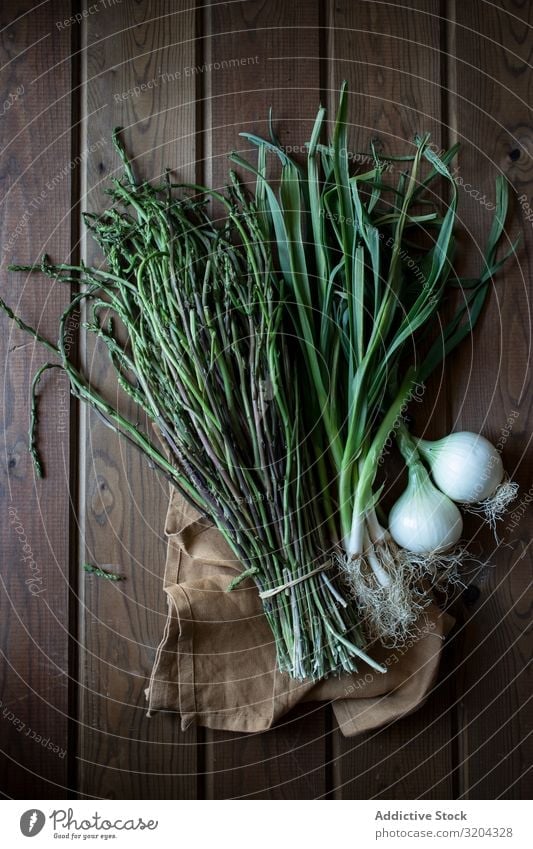 Fresh green asparagus with onion bulbs Green Asparagus Onion Organic Natural Food Bundle Cooking Delicious Nutrition Raw Mature Herbs and spices Leaf Rustic
