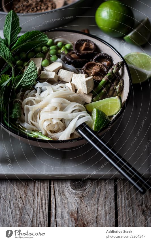 Pho soup with noodles Soup Vegetarian diet pho Mix Bowl Delicious Asian Food Cooking Dinner Tradition Tofu national Vegetable Table Chopstick Tasty Fresh