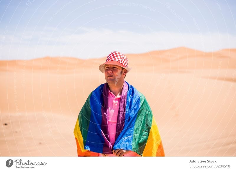 Gay standing in desert Homosexual Man lgbt Flag Desert Mature Love Middle-aged tolerance Laws and Regulations Pride Alternative Symbols and metaphors Rainbow