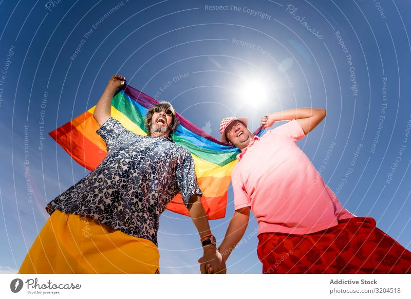 Excited plump gay couple in desert Homosexual Couple lgbt Flag Desert Excitement Mature Man Love boyfriends husbands Middle-aged tolerance Laws and Regulations