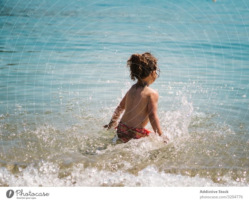 Cheerful girl having fun in warm sea Girl Water Ocean Warn Sister Playing Coast Swimming & Bathing Happiness Playful enjoying Beach Sunbeam Day