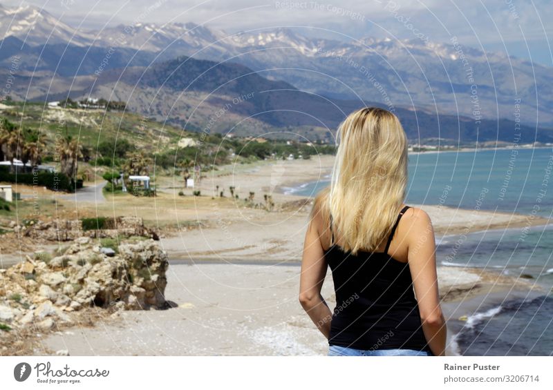 Blonde woman on the coast of Crete Feminine Young woman Youth (Young adults) Woman Adults 1 Human being Beautiful weather Mountain Peak Coast Ocean Blue Yellow