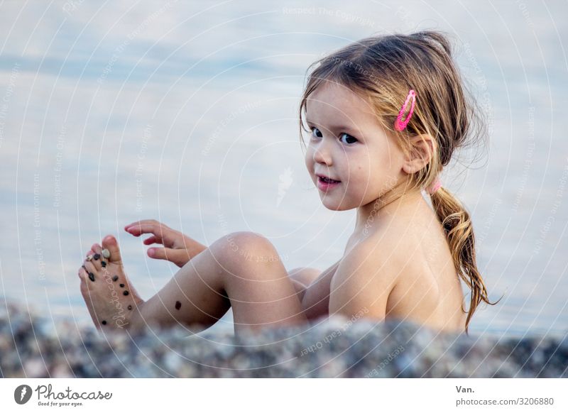 princess Girl Toddler Child Beach Ocean stones Pebble Gravel beach vacation Nature pretty cute Braids Playing