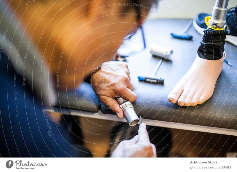 prosthesis workshop worker imitation adjusting medicine artificial object industry ankle healthcare made man limb single foot human technician adjustment clinic