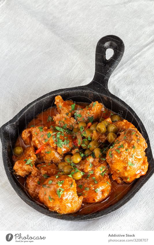 Cast iron pan with meatballs peas food delicious cooked tasty homemade vegetable gourmet green cast skillet black appetizer cuisine meal dinner dish healthy
