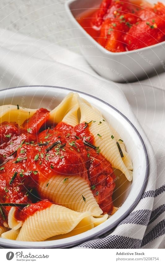 Big pasta shells cooked with tomato sauce food conchiglie delicious italian cuisine recipe macaroni dish appetizing gourmet fresh traditional meal prepared