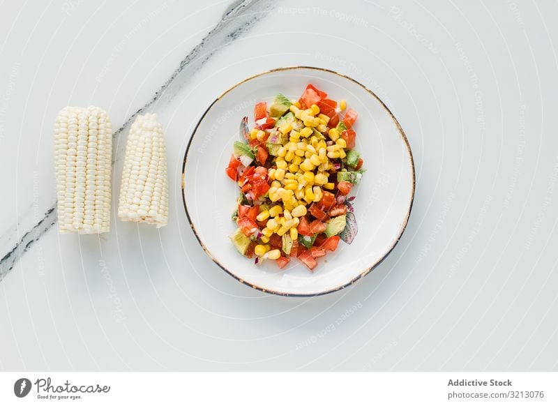 Served corn tomatoes and zucchini delicious served food meal gourmet cuisine nutrition dinner spice cut vegetable vegan vegetarian plate bowl tasty diet health