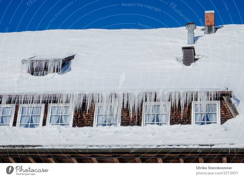 Eaves noses, icicles on snow covered roof of black forest house Trip Snow Winter vacation House (Residential Structure) Sky Cloudless sky Beautiful weather Ice