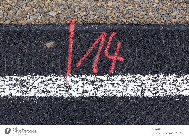 /14 | Written Street Road construction Digits and numbers Red Asphalt Gravel Signs and labeling Roadside Colour photo Downward