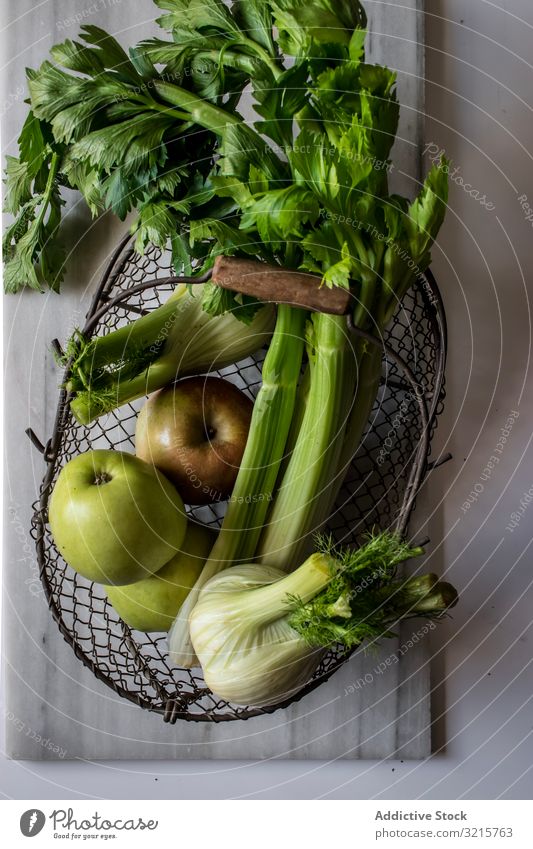 Green vegetables, fruits and nuts for cooking apple celery fennel walnut food basket green raw vegetarian delicious healthy fresh tasty organic gourmet