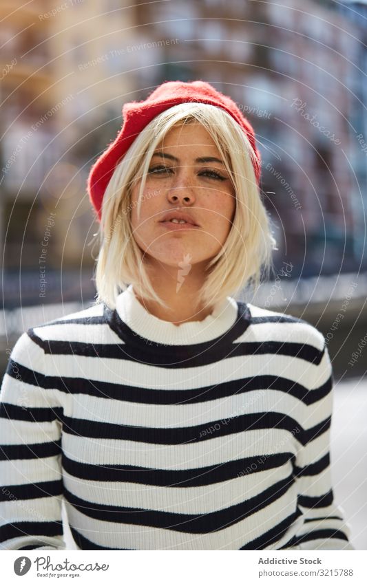 Beautiful female in red beret outdoors woman stylish trendy striped french fashion glamorous young person attractive beautiful casual blonde freckle pretty