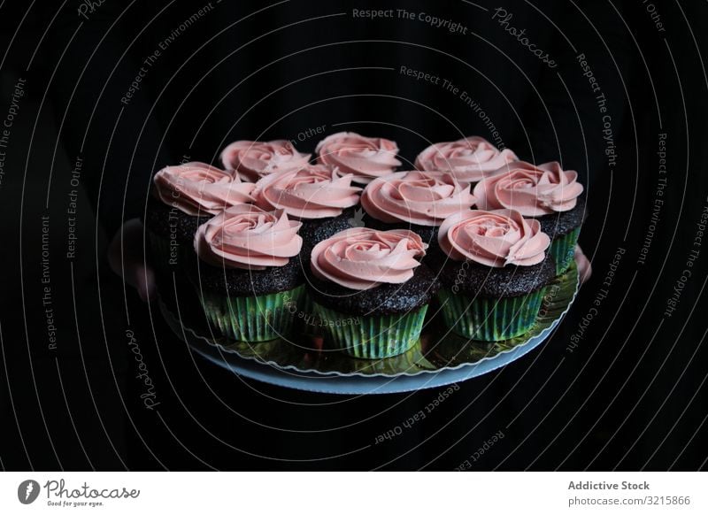 Cupcakes with pink frosting composed on plate cupcake cream sweet rose pastry food gourmet homemade cuisine delicious bakery dessert tasty biscuit snack fresh