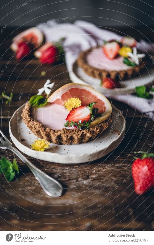 Strawberry and citrus cake served on wooden table strawberry dessert layout decoration rustic plate berries fork confectionery sweet grapefruit food tasty