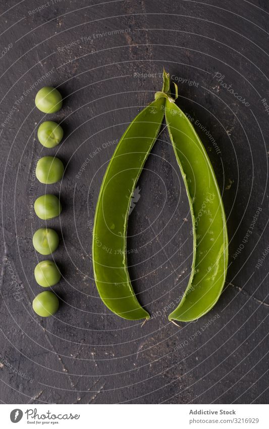 Fresh peas and pea pods on dark background ecological food fresh green healthy legume natural organic raw seed vegetable vegetarian harvest nutrition ingredient