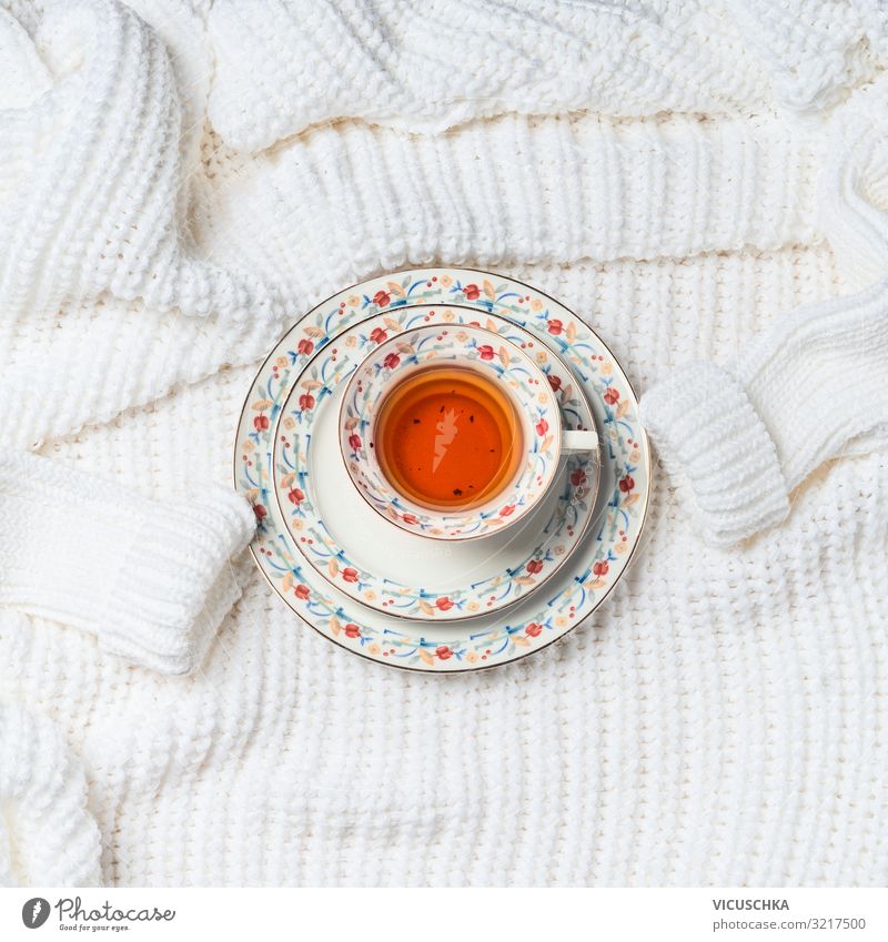 Cup of tea on knitted cardigan Beverage Hot drink Tea Lifestyle Style Design Winter Living or residing Sweater Background picture White Knitted Colour photo