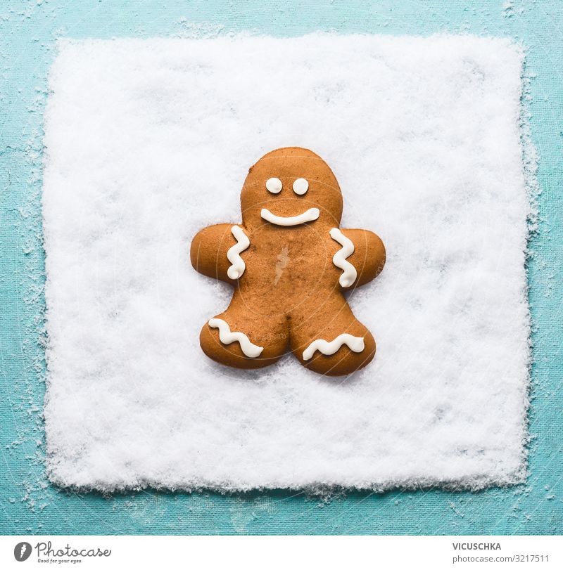 Gingerbread men on snow. Nutrition Design Joy Winter Christmas & Advent Snow Tradition Background picture Grinning Symbols and metaphors Gingerbread man