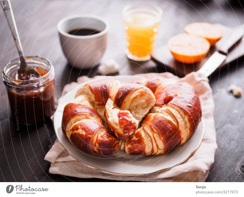 Breakfast with croissant and coffee Food Fruit Orange Dough Baked goods Croissant Jam Beverage Hot drink Juice Coffee Plate Cup Glass Knives Fragrance Eating