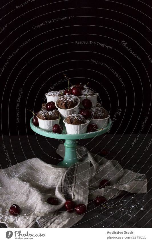 Plate with cupcakes and cherries cherry chocolate plate napkin heap sweet dessert fresh treat snack fruit berry food delicious tasty yummy scrumptious muffin