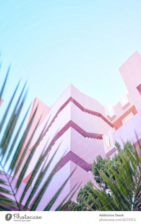Pink construction with stairs and floors building structure geometric architecture urban facade downtown center wall abstract sky public exterior innovation