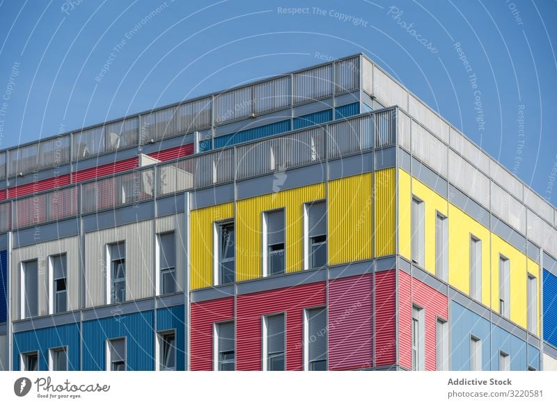 Facade of modern multicolored building with narrow windows exterior colorful architecture facade house property construction investment estate residential