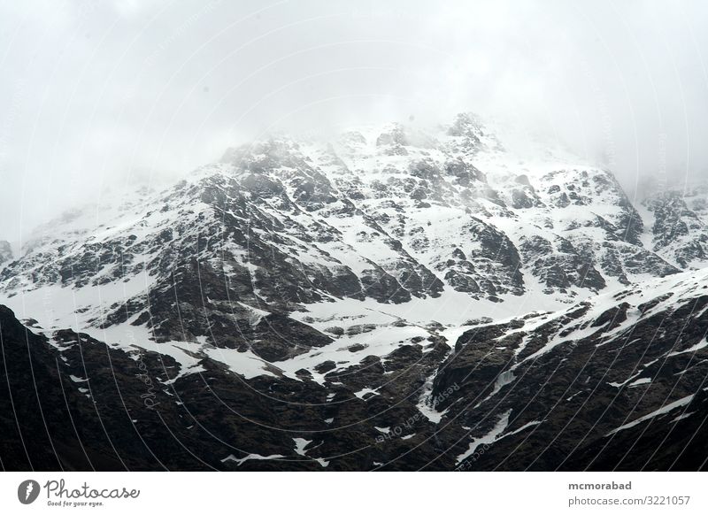 Snowy, Rocky Mountain Environment Landscape Clouds Fog White Vantage point scenery Appearance Scene Set panorama Topography terrain surroundings rock surface