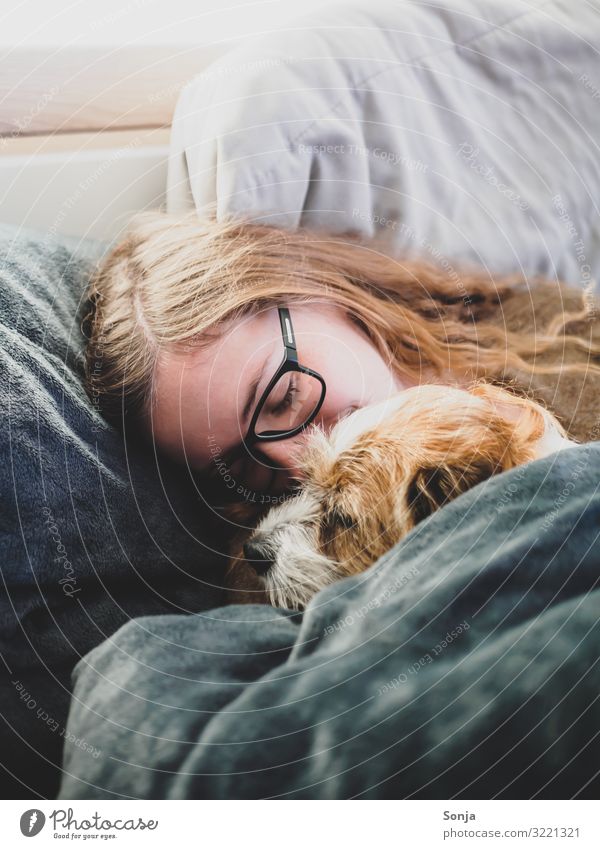 Young woman with small dog in bed Feminine Youth (Young adults) Life Head 1 Human being 18 - 30 years Adults Eyeglasses Brunette Long-haired Animal Pet Dog