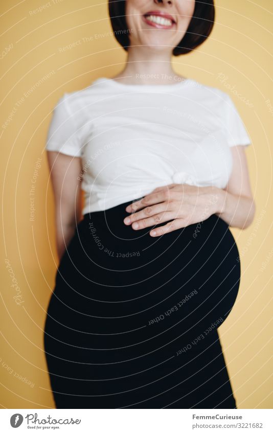 Urban young pregnant woman - neutral background Feminine Woman Adults 1 Human being 18 - 30 years Youth (Young adults) 30 - 45 years Happy Pregnant Baby bump