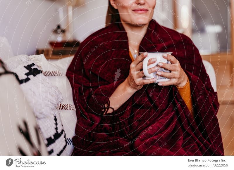 beautiful woman sitting on the sofa, enjoying a cup of tea. lifestyle indoors, autumn season Woman Tea Coffee Home Morning Caucasian Lifestyle Interior shot