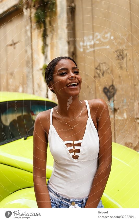 attractive young cuban woman , havana - cuba Lifestyle Happy Island Human being Young woman Youth (Young adults) Woman Adults Facade Street Jeans To enjoy