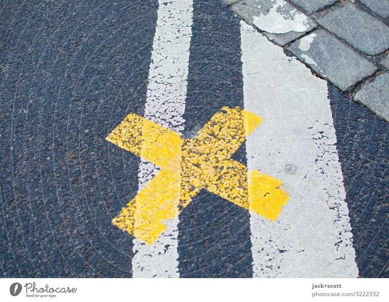 right here at the cross on the road Traffic infrastructure Street Lane markings Asphalt Cobblestones Crucifix Line Under Yellow Gray Safety Orderliness