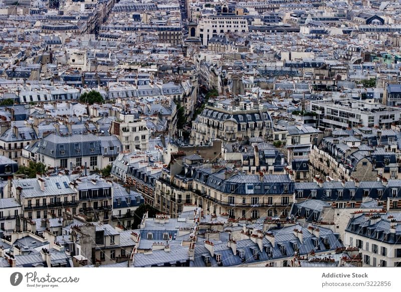 Densely populated old city city town dense architecture aged roof urban building residential house rooftop aerial block many window geometric background