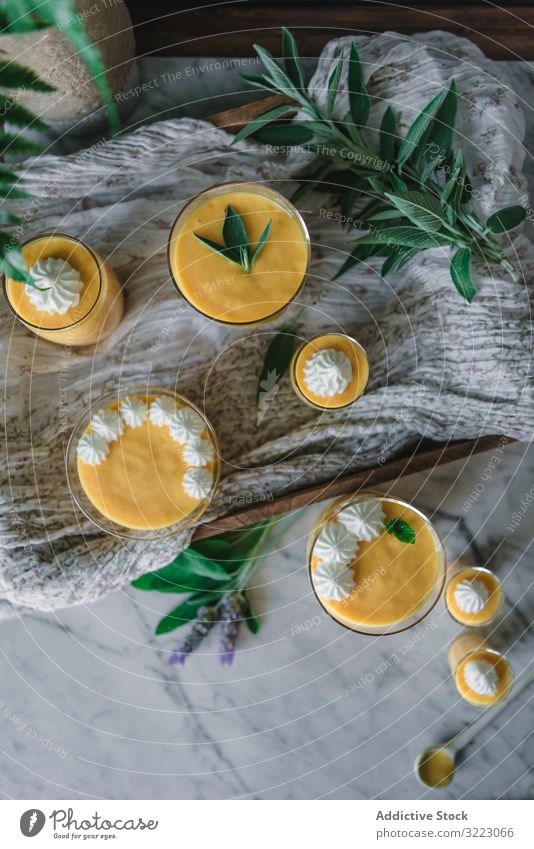 Mango dream in glass bowls on table mango cream mousse tasty food healthy dessert lunch yellow snack dish detox vegetarian decoration vegan delicious gourmet