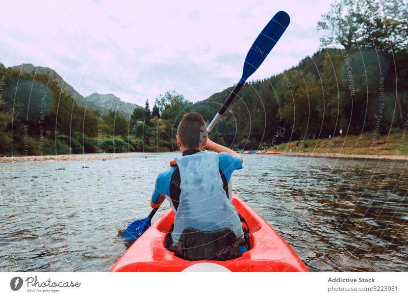 Female kayaking with paddle in raised hands woman sport sella river spain water canoe activity tourism adventure lifestyle travel female joyful athletic fit