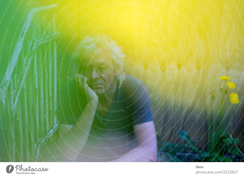 thoughtful man Human being Masculine Man Adults Life 1 45 - 60 years Nature Flower Observe Think Looking Sit Fantastic Yellow Green Emotions Secrecy Curiosity