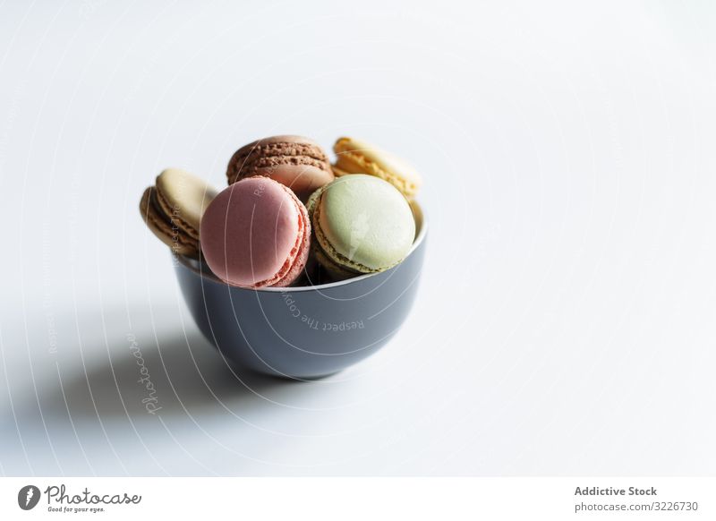 Bowl of colorful macaroons bowl dessert table treat sweet food fresh cuisine yummy delicious tasty scrumptious crunchy calorie snack lumber traditional dish