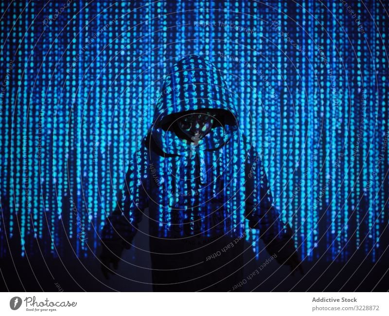Little hacker in digital code projection boy concept little programmer virus password software kid child hoodie scam database pc website information