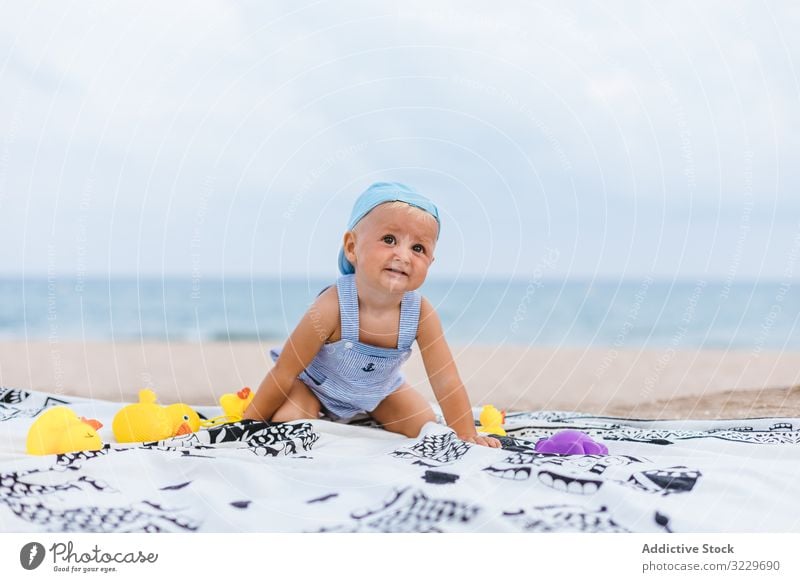 Baby boy playing with rubber ducks summer beach toys innocence happy little 5 months blond life little infancy childcare male newborn sweet caucasian infant