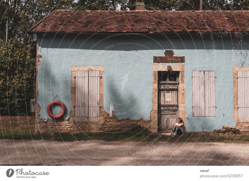 old light blue cottage with waiting girl Child 1 Human being Village House (Residential Structure) Lanes & trails Observe Think Relaxation To enjoy Crouch Wait