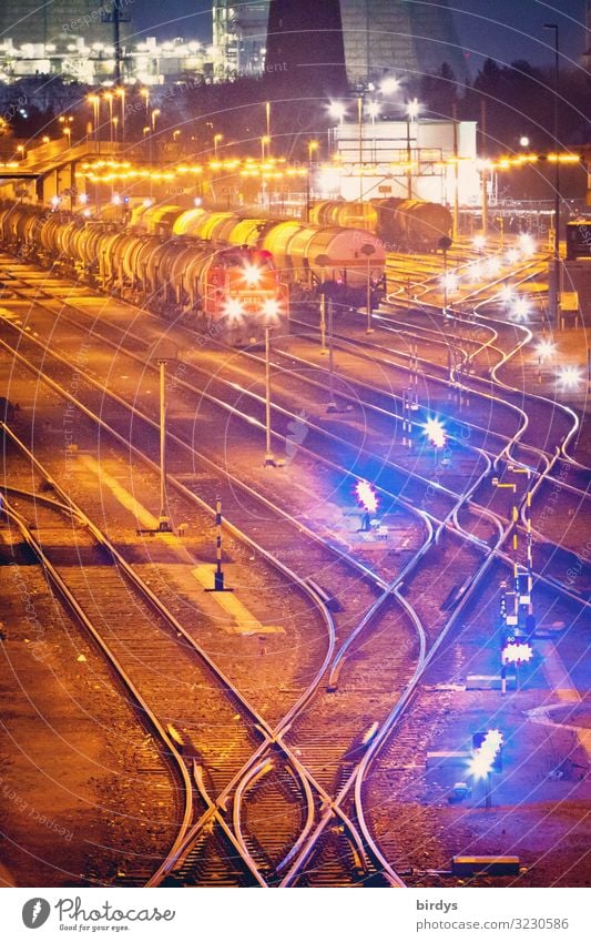 illuminated freight station with trains and wagons at night Industry Logistics Germany Train station Rail transport Railroad Freight train Freight cars