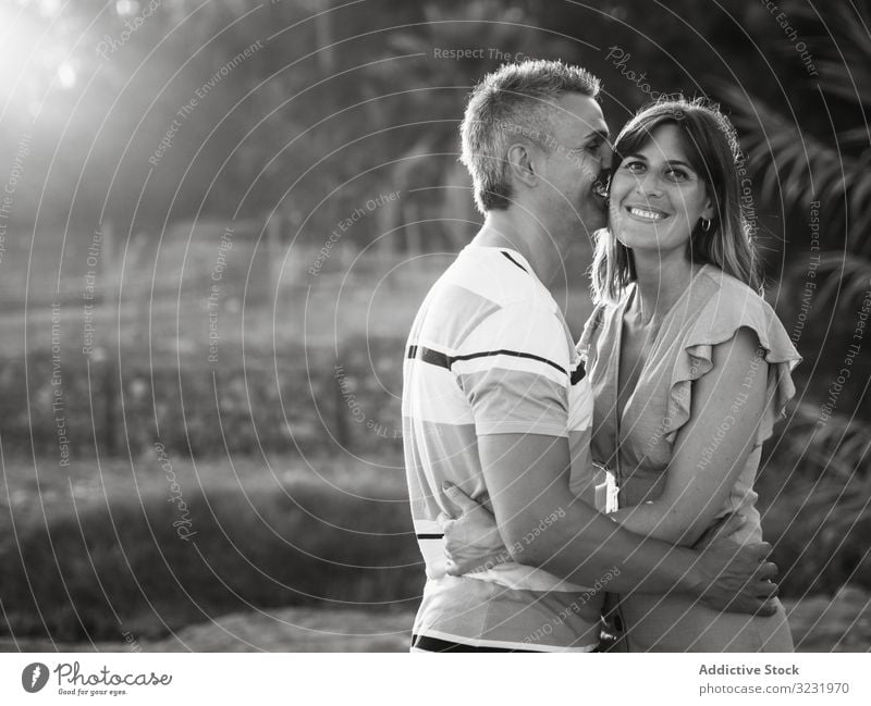 Happy couple looking at each other love smile happy vacation sunny daytime man woman adult honeymoon summer nature shore coast relationship holiday tropical