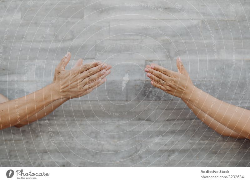 Hands on background of grey wall gesture opposite dislike finger thumb success creative choose upset happy hand positive gesturing confident concept failure