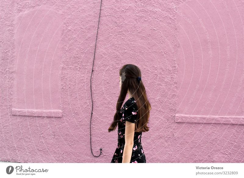 Pink Wall Young woman Youth (Young adults) 1 Human being 13 - 18 years Outskirts Dress Brunette Long-haired Stand Beautiful Colour photo Exterior shot