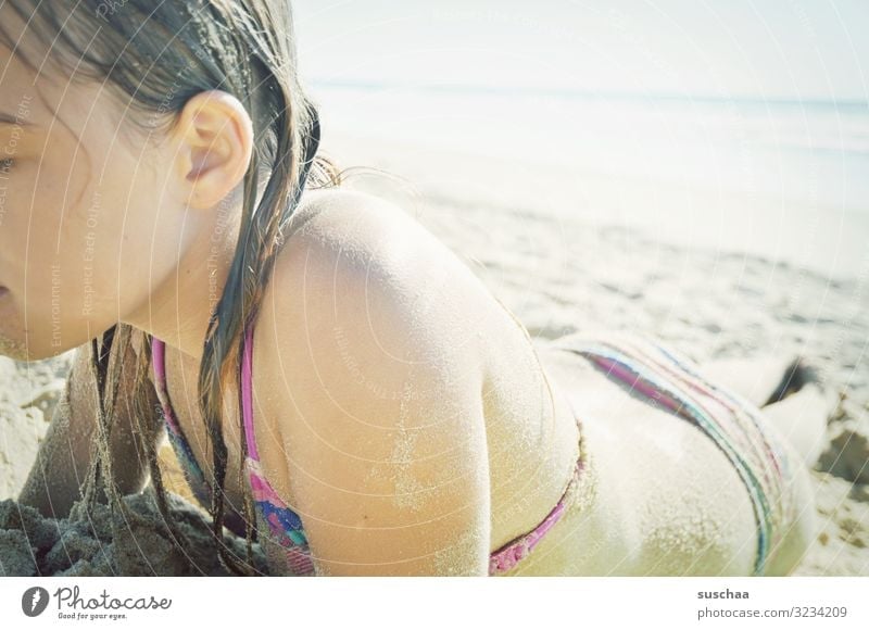 girl on the beach Child Beach Sand Bikini wide Ocean Water Vacation & Travel Summer Coast Relaxation Summer vacation wet hair rubbed with sand Sky sunshine