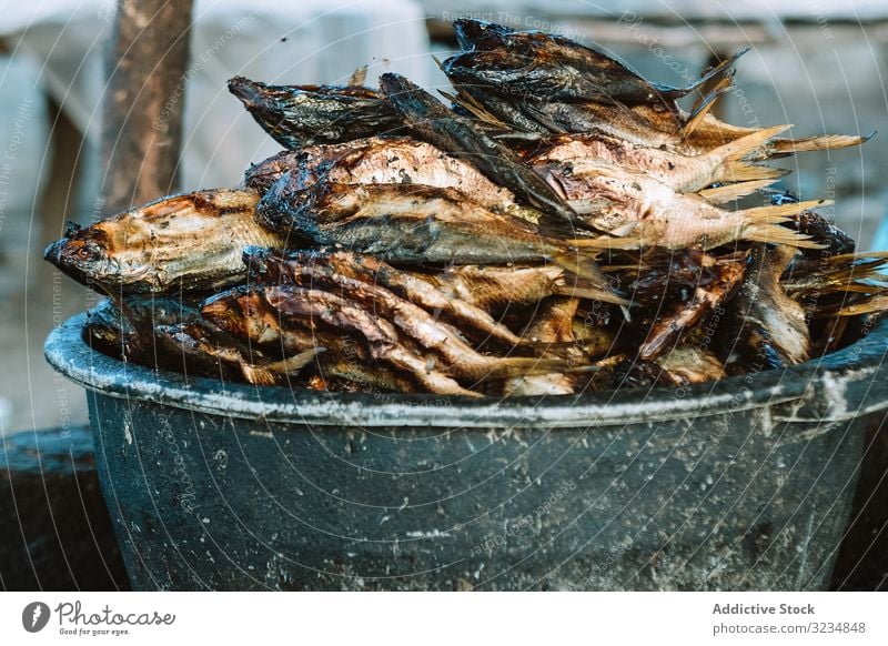 Bowl with heap of dried fish market bowl food seafood traditional cuisine smell many pile weathered grungy marketplace vendor sell trade dish meal prepared