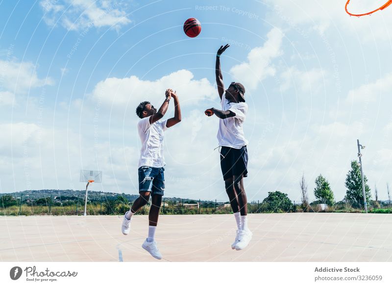 African American guys playing basketball in bright day sportsmen training player activity athlete skill action black african american court athletic